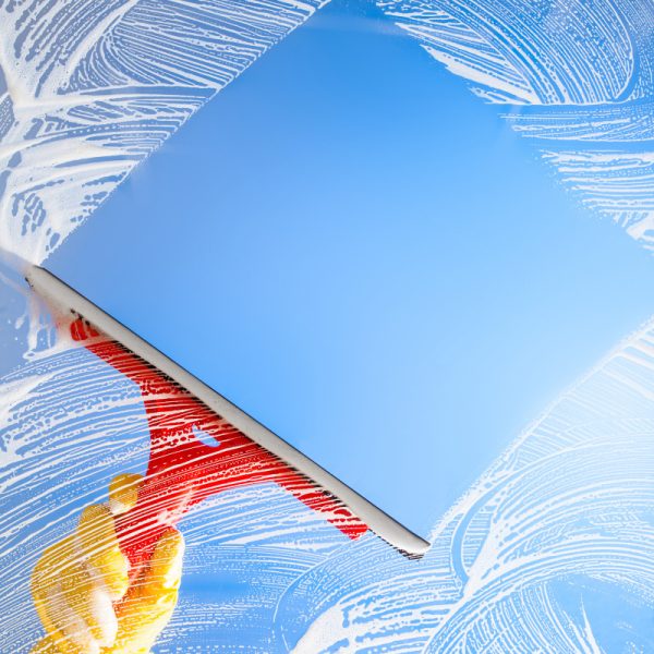cleaning-window-with-squeegee